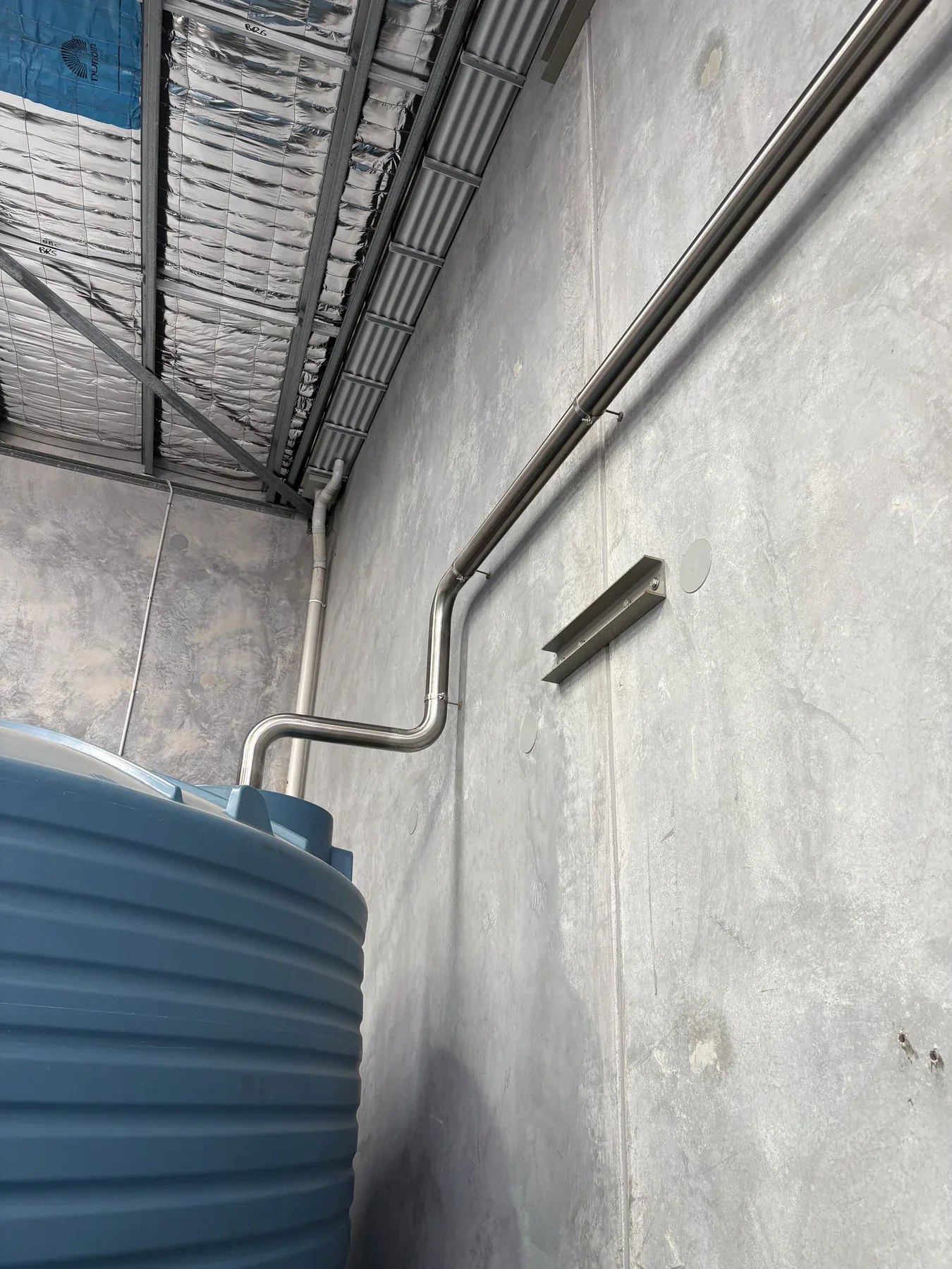 Elevated stainless steel process line installed on site